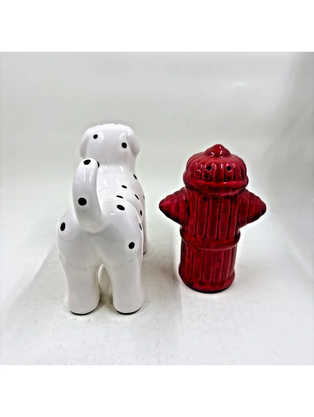 Ceramic Dalmatian dog and fire hydrant ceramic salt & pepper shaker set